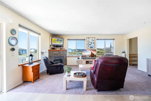Light & Bright Upstairs living space with propane fireplace.