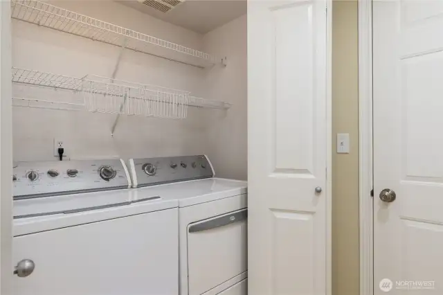 Laundry closet just off the garage. Washer & dryer stay!