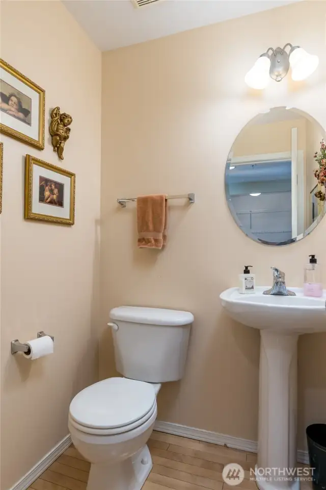 Half bath downstairs, just off the garage entrance