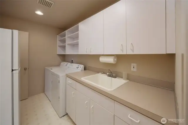 Laundry room w/sink & storage + extra fridge