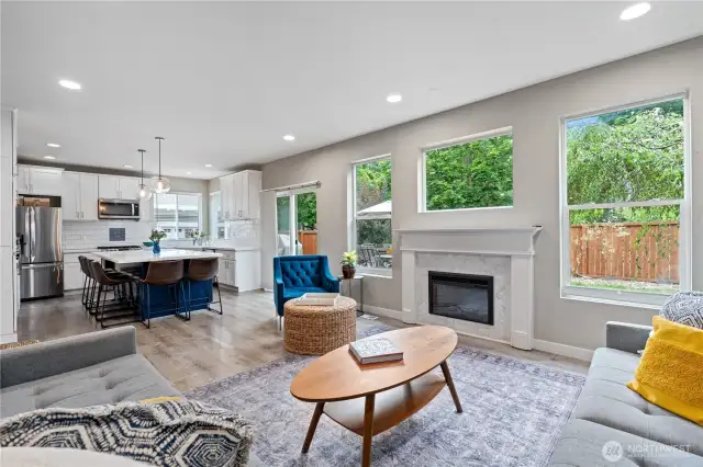 The great room flows into a modern kitchen, creating an ideal space for entertaining.