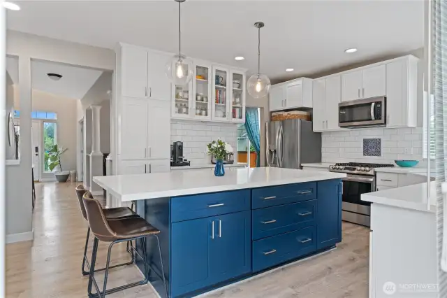 The kitchen flows effortlessly into the heart of the home—perfect for everything from casual weeknight dinners to lively weekend celebrations.
