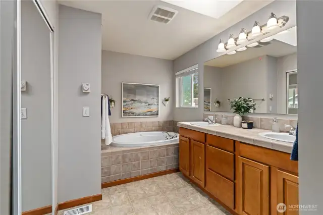 The master bath includes a large soaking tub.
