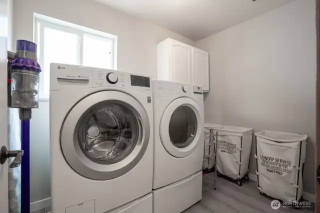 The upstairs laundry room features plenty of space and a surprise...