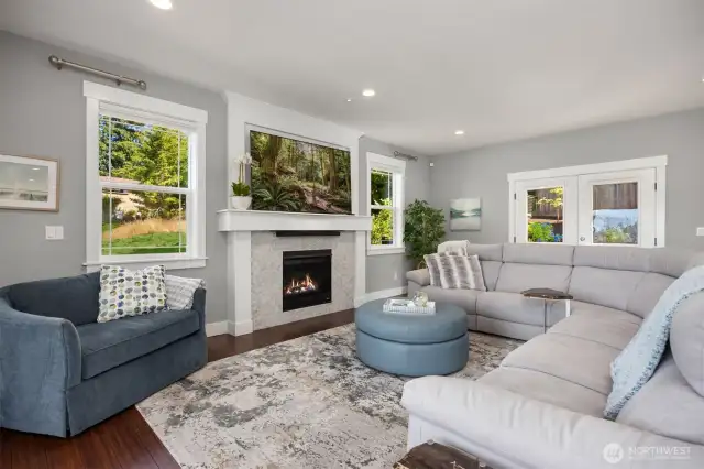 Stunning propane fireplace with TV above. (TV does convey).