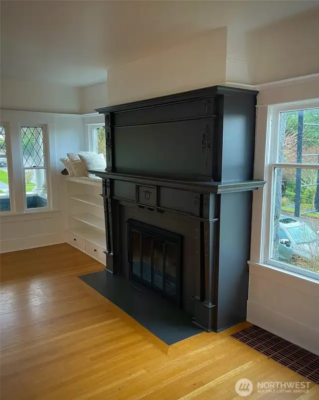 Apt A features leaded glass windows, fir floors, original classic mill-work, and a vintage fireplace that together create a warm, timeless ambiance.