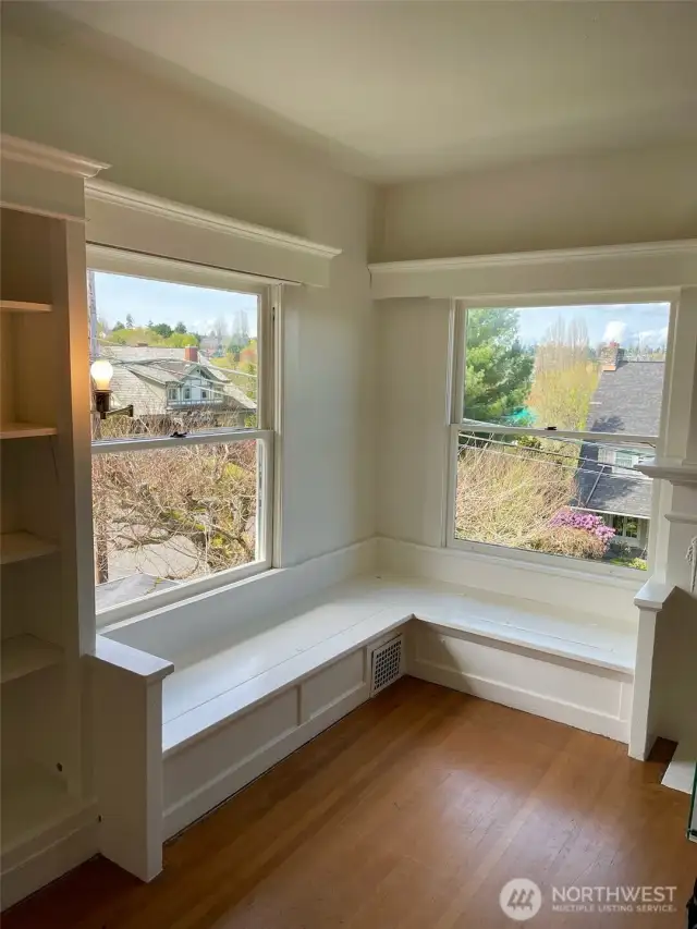 Apt D - Built-in window seat brings classic architecture to the room.