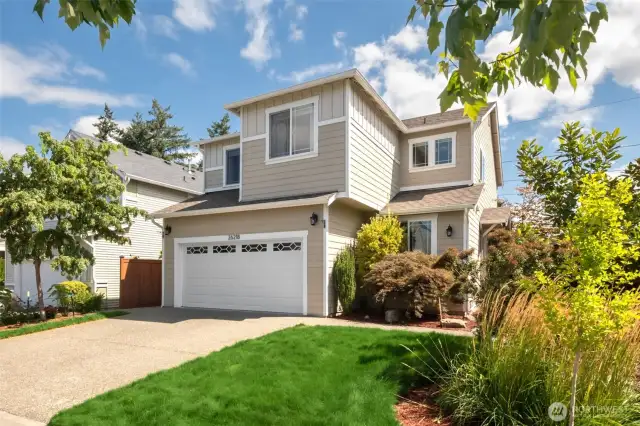 Step into this well-kept, move-in ready 2-story home in Covington WA. To the left of the garage is a beautiful and unique Twisty Baby Tree (a type of locust tree) that the owner planted and cared for!