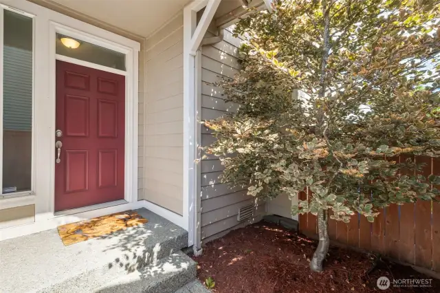 The secluded, covered front porch provides privacy