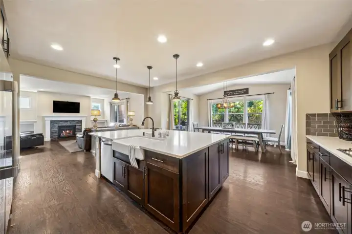 View of great room and sun room/ dining from kitchen