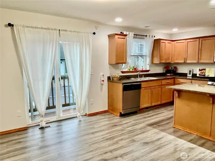 Spacious open floor plan.  New flooring and paint.  Sliding window to deck.  Dining room and Kitchen