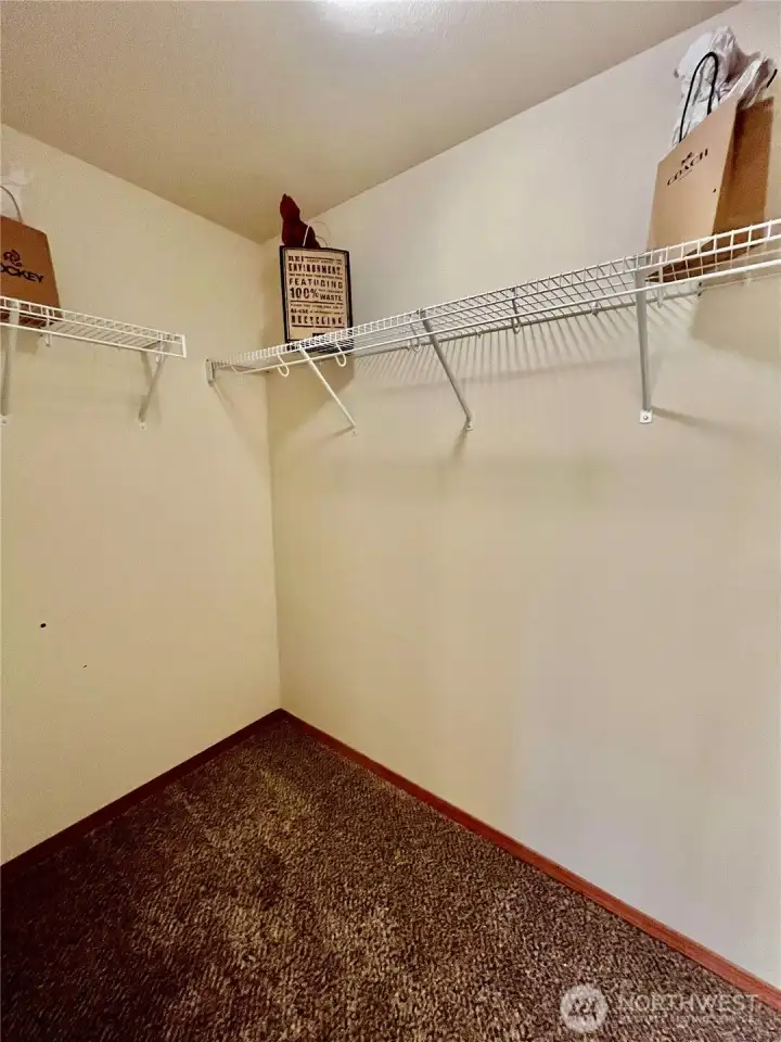 Primary bedroom walk in closet