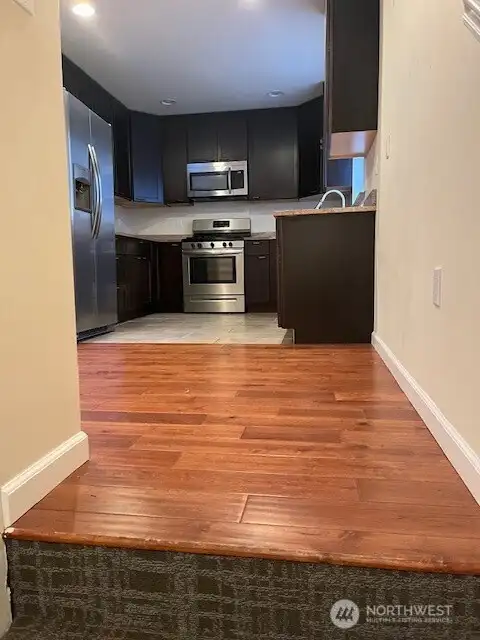 Enter the main floor and walk into your spacious kitchen area.