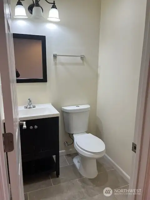 Main level bathroom convenienntly located with the kitchen and living area.