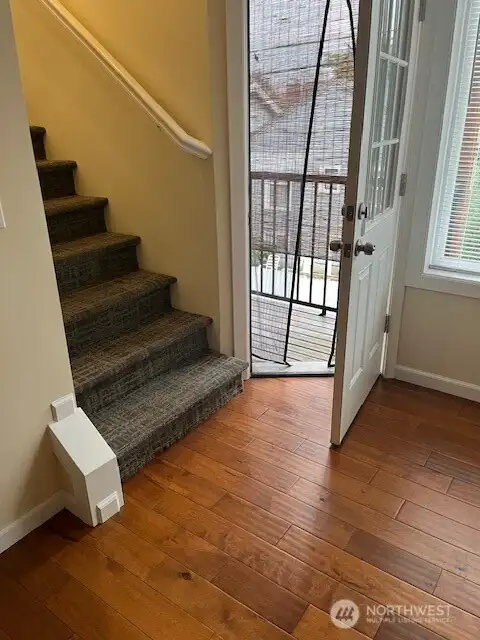 The main living area has a deck area with views. Take the stairs to the bedroom areas.
