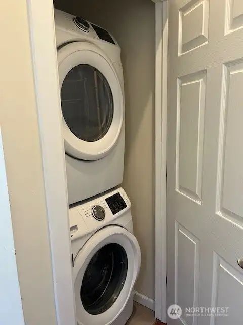 Thelaundry area is above the main living area and close to the bedrooms.