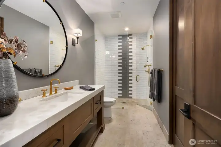 Photos are from a different though similar style home. Actual finishes and look will be dictated by actual finishes selected by buyer. Guest Bathroom on main floor