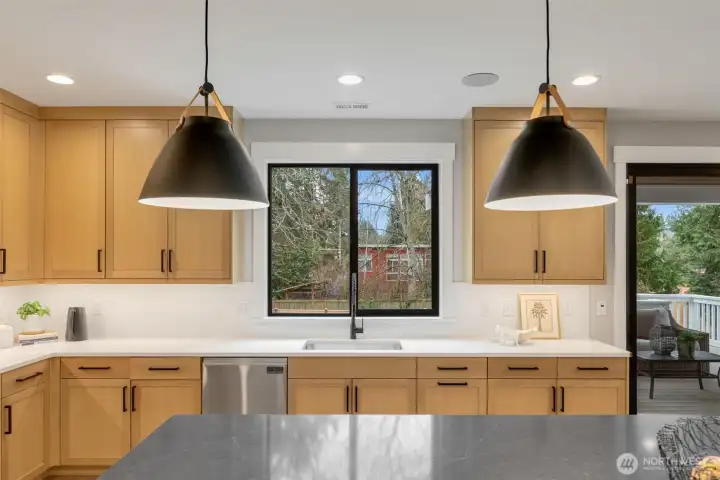 WOW! This kitchen is both beautiful and practical. Wide aisles, high end appliances, tasteful fixtures and walk in pantry.