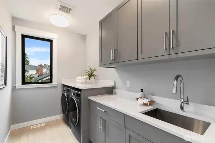 Spacious and practical upper floor laundry room.