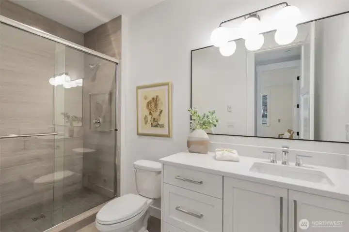 Lower level bathroom adjacent to the 5th bedroom.