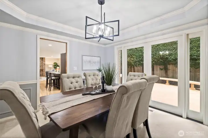 Formal dining with French door access to beautiful wraparound deck.