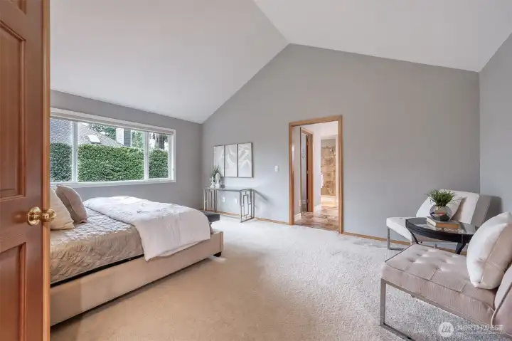 Spacious primary suite featuring a large ensuite bathroom and dual walk-in closets