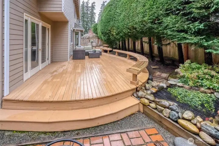 Wow! Beautiful deck to chill or entertain all year long. Serene fishpond.  Paver walkway!  Fall in love with this beautiful home! So private!