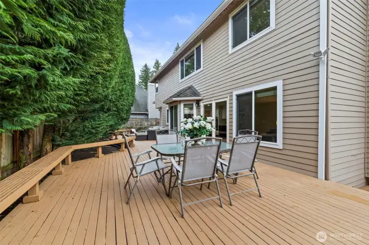 Another angle view of the expansive entertainment deck, perfect for outdoor dining and gatherings.