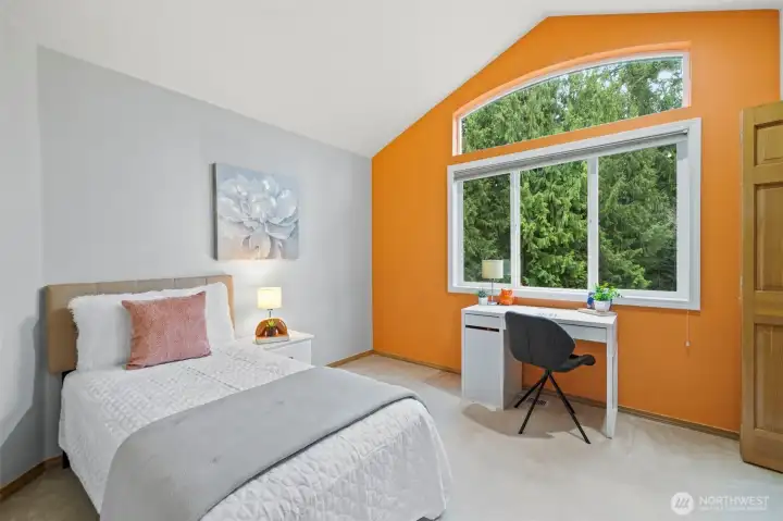 2nd bedroom upstairs boasting high ceiling.