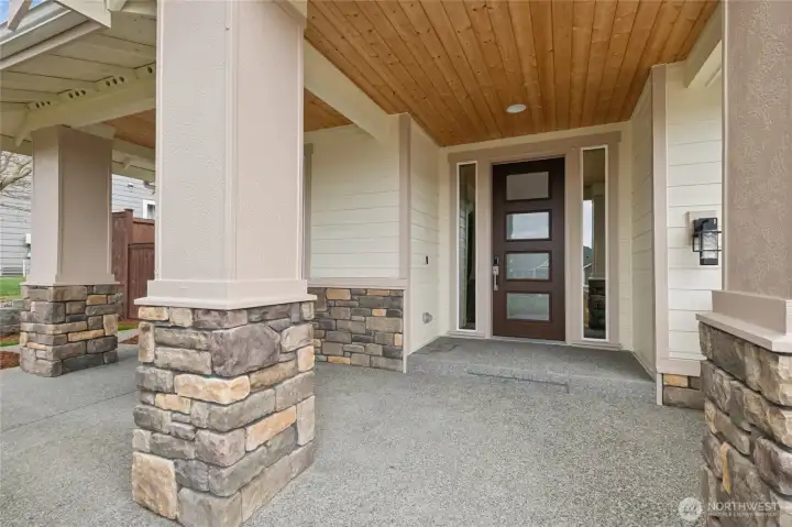 The generous covered front porch provides a welcoming outdoor retreat with scenic outlooks, shelter for guest and packages, and all-season usability.