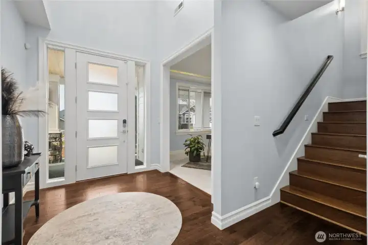 Soaring two-story foyer offering an airy feel and an elegant introduction to the home.