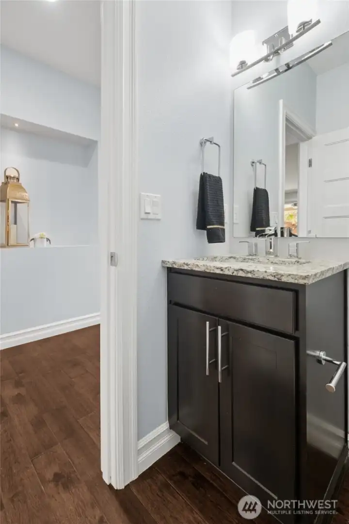 Convenient main-level powder room, ideally located for guests and everyday use.