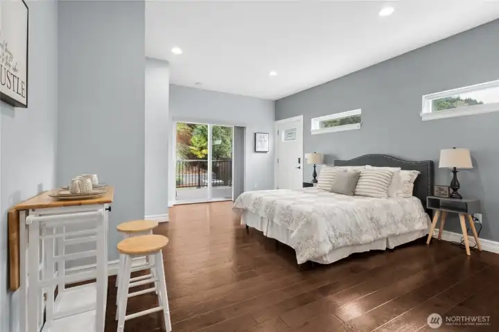 Exceptional studio apartment on the main floor offering a full bath, kitchenette, washer/dryer, private deck, and separate exterior access.