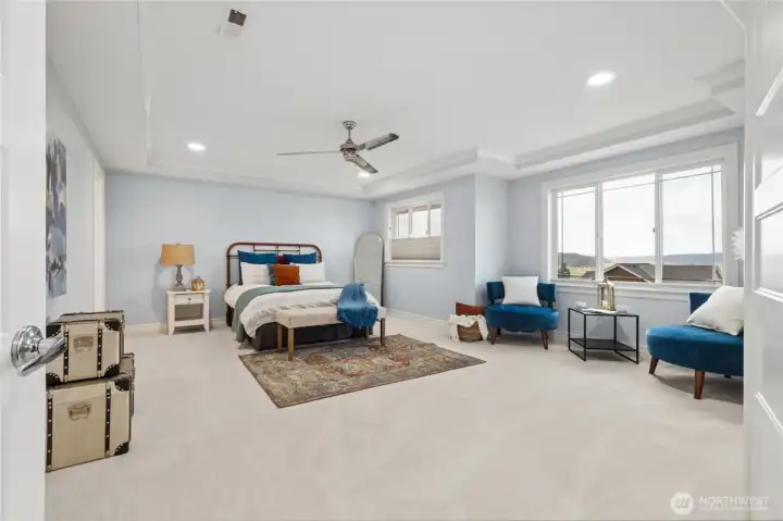 Grand primary suite with the home’s most breathtaking vantage point, capturing sweeping foothill and valley views.