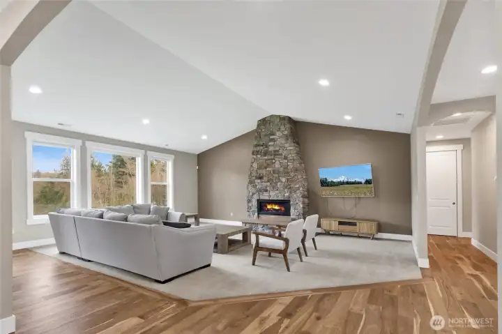 Airy bright great room with vaulted ceilings and gas fireplace