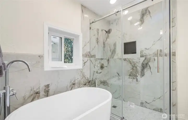 Master custom tiled shower & stand alone tub