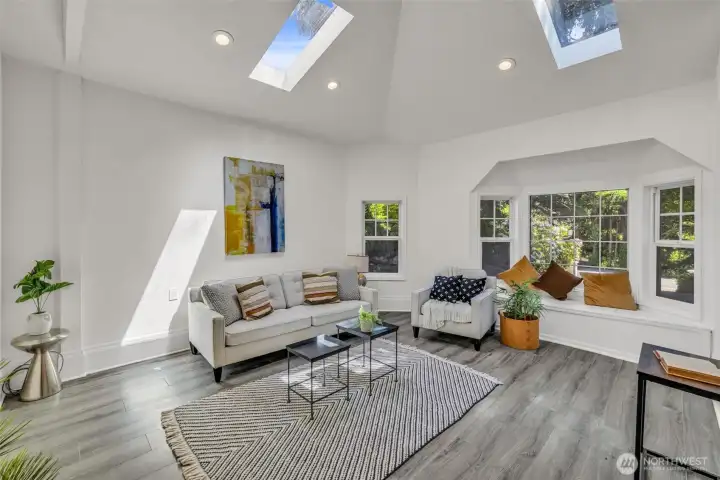So much natural light pours into the upper living room, off the kitchen.