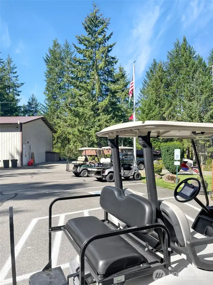 Club house parking lot area where many of the residence's get about in their golf carts.