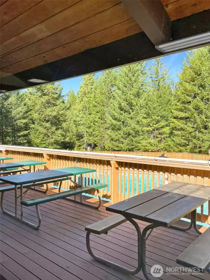 Outdoor seating at the Club house that over looks the Pool.