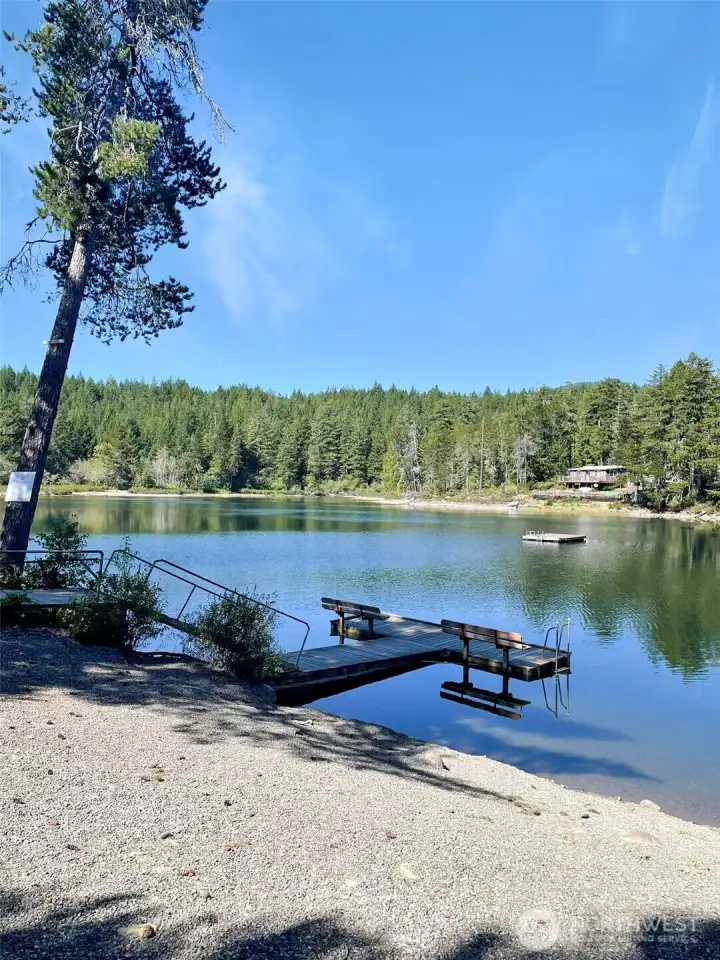 Lake access inside the community. Dock, seating area and circular driveway to get in and out.