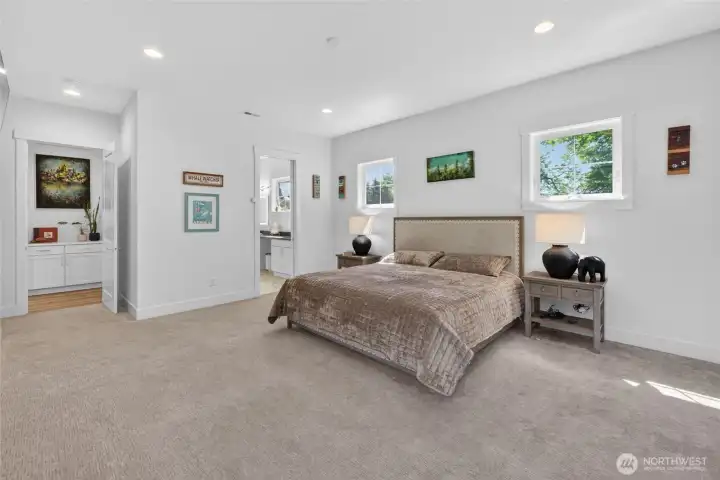 Inviting primary suite with access to patio