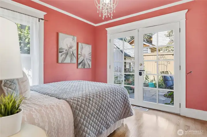 Bedroom 1 showing french doors shut.  Could this get any more charming?