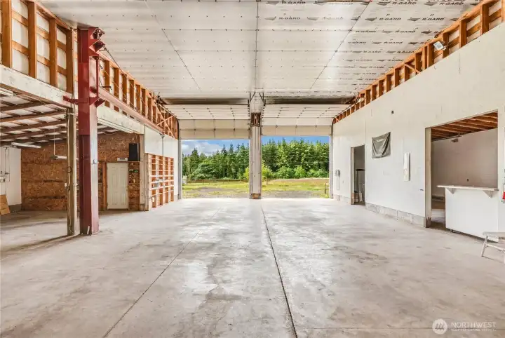 With two 14-ft doors at the entry and a 14 ft door at the rear, this drive-thru shop can accommodate large trucks, work vehicles, or massive storage. With two 14-ft doors at the entry and a 14 ft door at the rear, this drive-thru shop can accommodate large trucks, work vehicles, or massive storage.