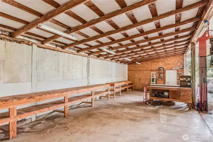 With built-in workbenches, a pit, air compressor, separate office, and more, this incredible shop offers so much to the future owner. With built-in workbenches, a pit, air compressor, separate office, and more, this incredible shop offers so much to the future owner.