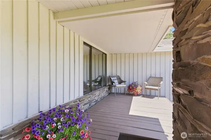 A partially covered front porch invites you to take in the quiet views of the front pasture and trees. A partially covered front porch invites you to take in the quiet views of the front pasture and trees.