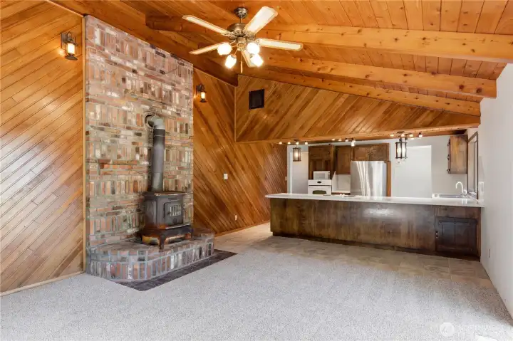 Come unwind in this delightful room with vaulted ceilings, a wood stove, and original wood-lined walls and ceiling! Come unwind in this delightful room with vaulted ceilings, a wood stove, and original wood-lined walls and ceiling!