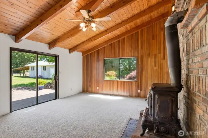 This room steps out to the large back deck overlooking the scenery of the backyard. This room steps out to the large back deck overlooking the scenery of the backyard.