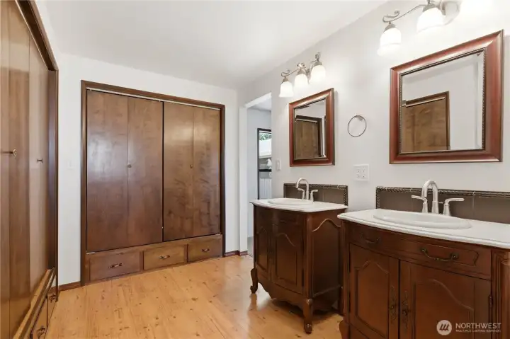 With dual sinks and two large closets, the primary bath is spacious and functional. With dual sinks and two large closets, the primary bath is spacious and functional.