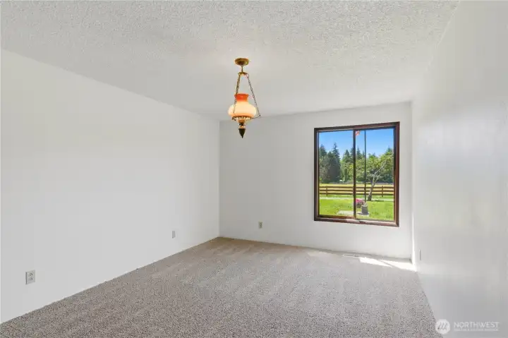With room for everyone, the home features three guest bedrooms in addition to the primary suite. Shown here is the first bedroom. With room for everyone, the home features three guest bedrooms in addition to the primary suite. Shown here is the first bedroom.