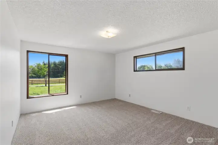 The second bedroom is located in the front corner of the home and also overlooks the front yard. The second bedroom is located in the front corner of the home and also overlooks the front yard.